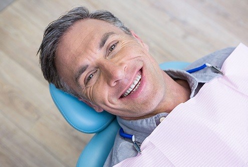 Smiling man in dental chair