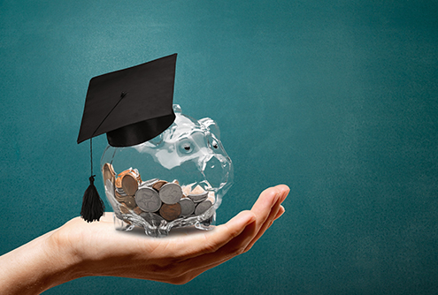 Piggy bank with graduation cap