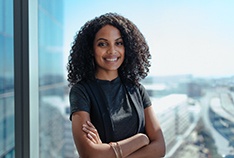 Business professional smiling in office building