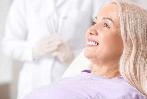 Woman after learning how dentures are made in McMinnville