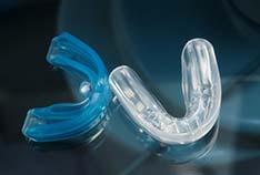 Closeup of mouthguards for preventing dental emergencies in McMinnville 