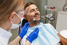 Implant dentist in McMinnville working with a patient