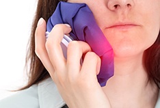 Applying a warm or cold compress after dental implant surgery can help reduce pain and swelling