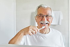 You can begin gently brushing your teeth again the day after dental implant surgery