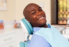 Man smiles after getting dental implants in McMinnville