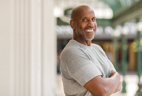 man smiles after getting dental implants in McMinnville