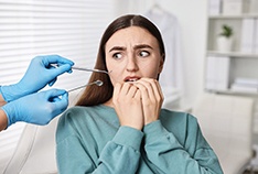 a dental patient showing signs of anxiety