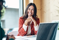 Woman smiling during meeting in office