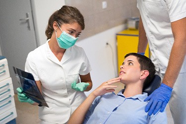 Patient in St. Joseph wincing at dentist