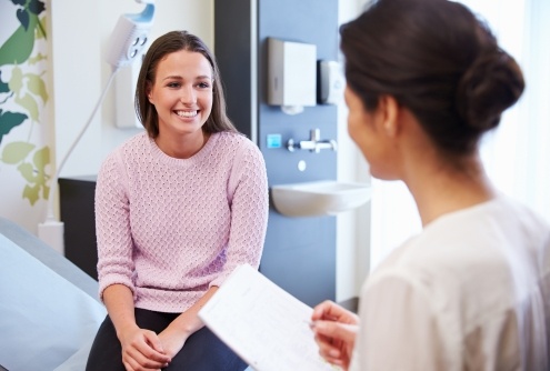 Woman smiling at dentist