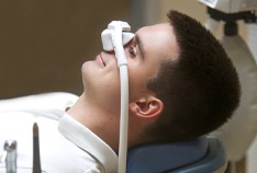 Smiling man relaxing with nitrous oxide dental sedation in McMinnville
