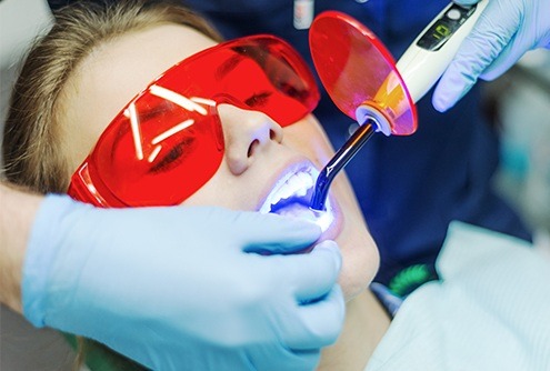 Patient receiving dental sealants