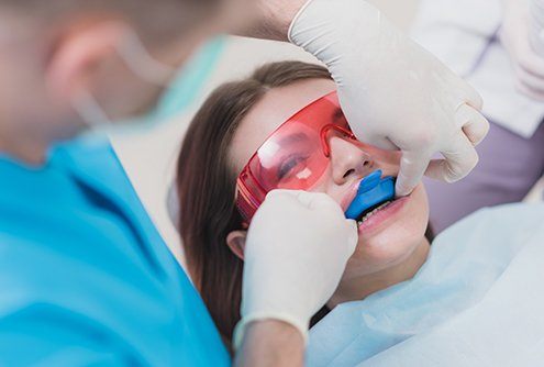 Young person receiving fluoride treatment