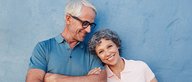 Smiling older man and woman outdoors