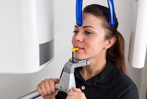 Woman receiving CT cone beam scan