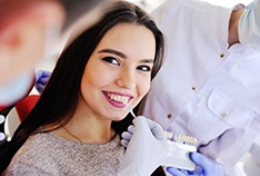 Woman smiling during veneers consultation