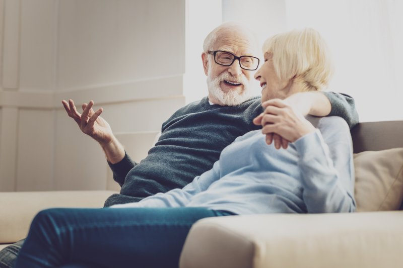 mature couple talking with dentures 