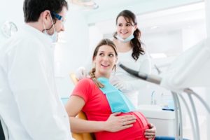 pregnant woman talking to her sedation dentist in McMinnville 