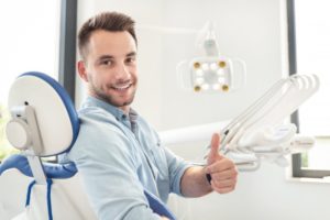 dental patient giving thumbs up before getting root canal in McMinnville 