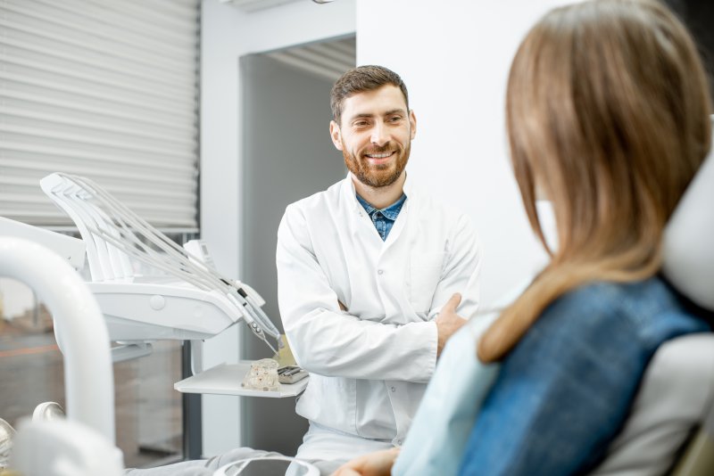 dentist answering frequently asked questions about sedation dentistry in McMinnville