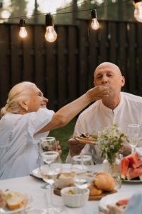 Older couple enjoying an outdoor meal