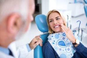 a patient visiting her dentist for a root canal 