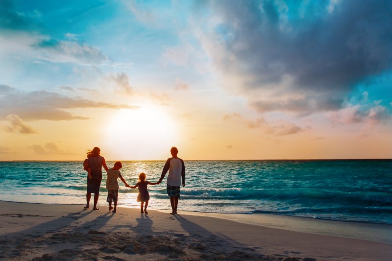 family playing on a beach