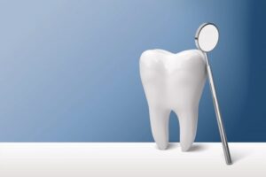 Image of a tooth on a table against a blue background